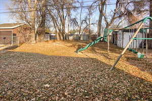 View of yard featuring a playground