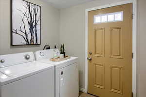 Clothes washing area with washer and clothes dryer