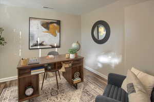 Home office featuring wood-type flooring