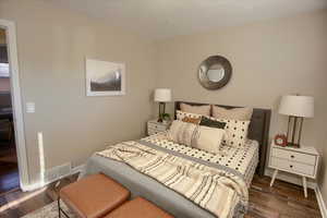 Bedroom featuring dark hardwood / wood-style floors