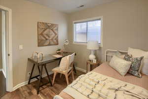 Bedroom featuring hardwood / wood-style flooring