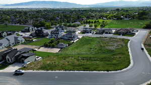 Drone / aerial view with a water and mountain view