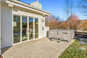 View of patio / terrace with a hot tub