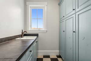 Laundry room featuring sink