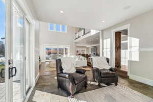 Living room with hardwood / wood-style flooring