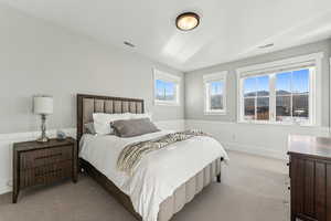 Carpeted bedroom featuring a mountain view