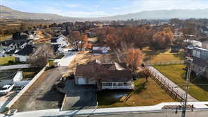 Birds eye view of property with a mountain view