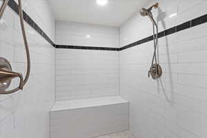 Bathroom featuring tiled shower