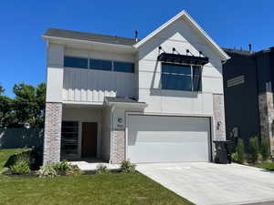 View of front of property featuring a garage