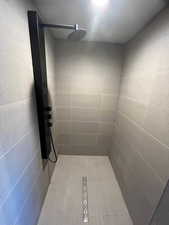 Bathroom with a tile shower