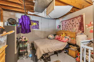 Bedroom with concrete floors