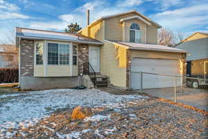 View of front of home featuring a garage