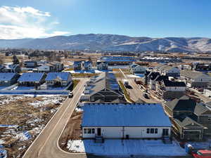 Snowy aerial view featuring a mountain view