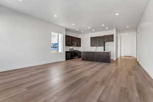 Unfurnished living room with light wood-type flooring