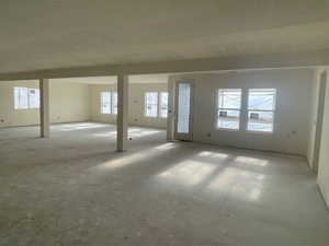 Vast Great Room with oversized windows and walk out.