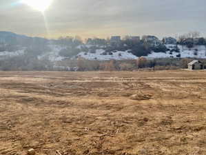 View of the oversized homesite, open space, and homes on the other side of the canyon.