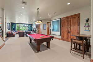 Playroom with light carpet and billiards