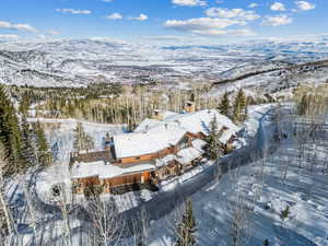 Snowy aerial view with a mountain view