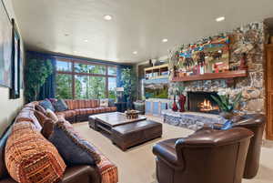 Living room with light carpet and a fireplace