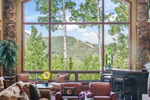 Sunroom featuring a mountain view