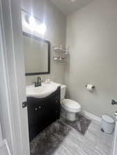 Bathroom featuring vanity and toilet