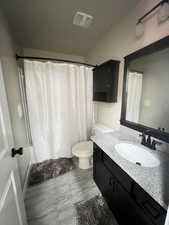 Bathroom with vanity and toilet