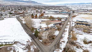 Snowy aerial view with a mountain view