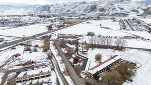 Snowy aerial view with a mountain view