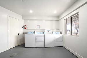 Washroom featuring washer and clothes dryer