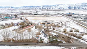 Snowy aerial view featuring a mountain view