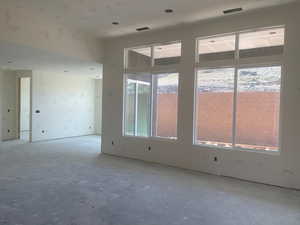 Spare room featuring concrete floors