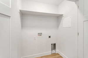 Laundry area featuring washer hookup, light hardwood / wood-style floors, and hookup for an electric dryer