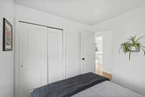 Bedroom featuring hardwood / wood-style flooring and a closet