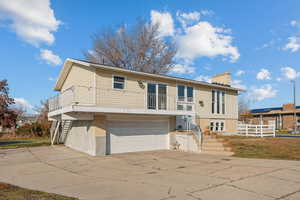 Split foyer home featuring a garage