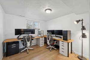 Office space featuring light wood-type flooring