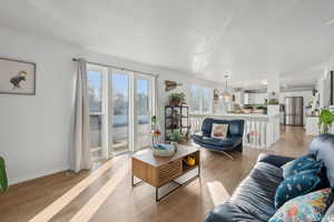 Living room with light hardwood / wood-style flooring