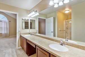 Bathroom featuring vanity and walk in shower