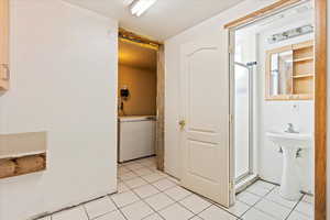 Bathroom with tile patterned floors and walk in shower