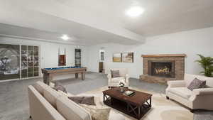 Recreation room featuring a brick fireplace, carpet floors, and pool table