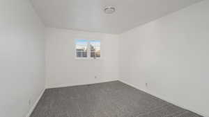 Spare room with carpet flooring