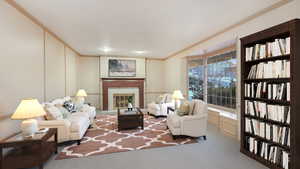 Carpeted living room with crown molding