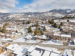 Snowy aerial view featuring a mountain view