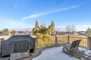 Deck featuring grilling area and spectacular views of the lake and mountains