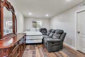 Bedroom featuring dark hardwood / wood-style flooring