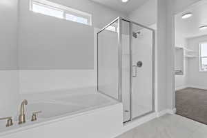 Bathroom with shower with separate bathtub