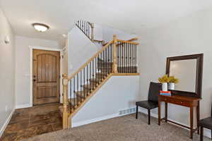 View of carpeted foyer entrance