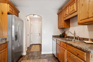 Kitchen featuring appliances with stainless steel finishes and sink