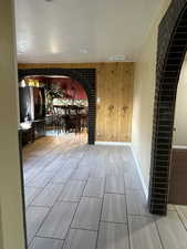 Unfurnished dining area with wooden walls