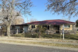 Ranch-style house featuring a garage