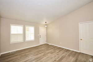 Empty room featuring hardwood / wood-style flooring